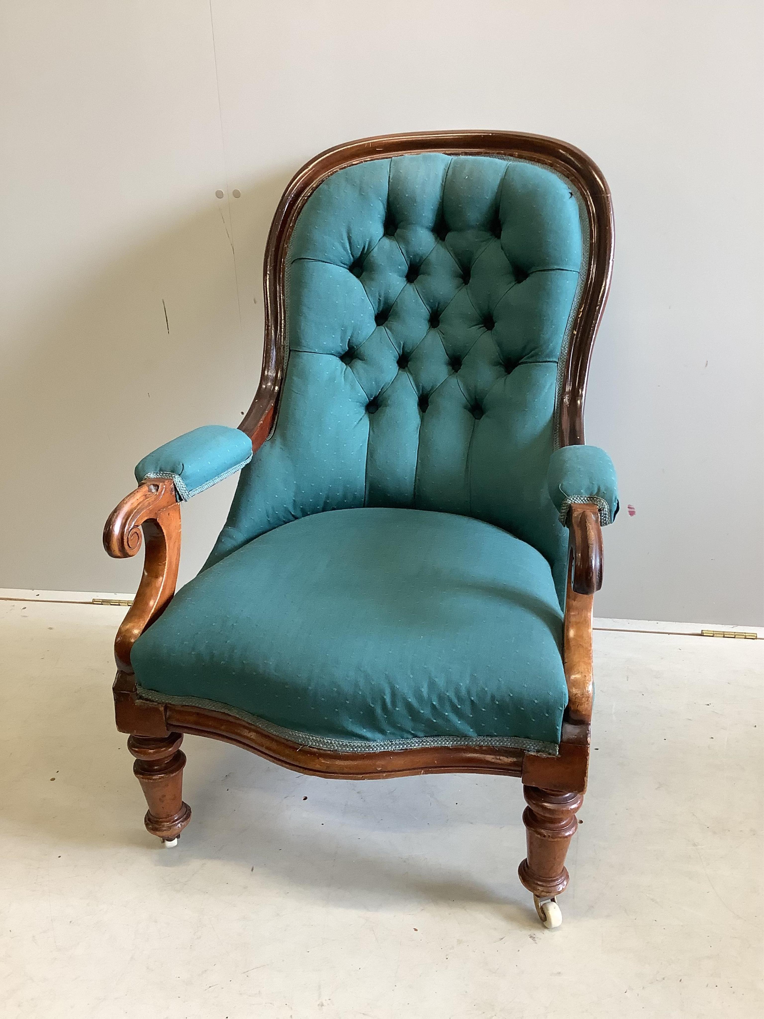 A Victorian upholstered mahogany spoon back open armchair, width 68cm, depth 78cm, height 99cm. Condition - fair